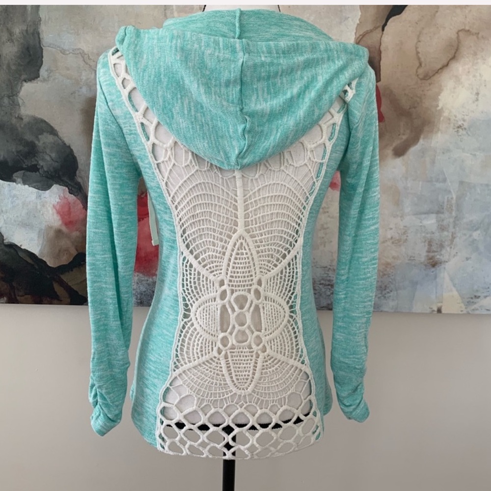 A sweater with a crochet back size s